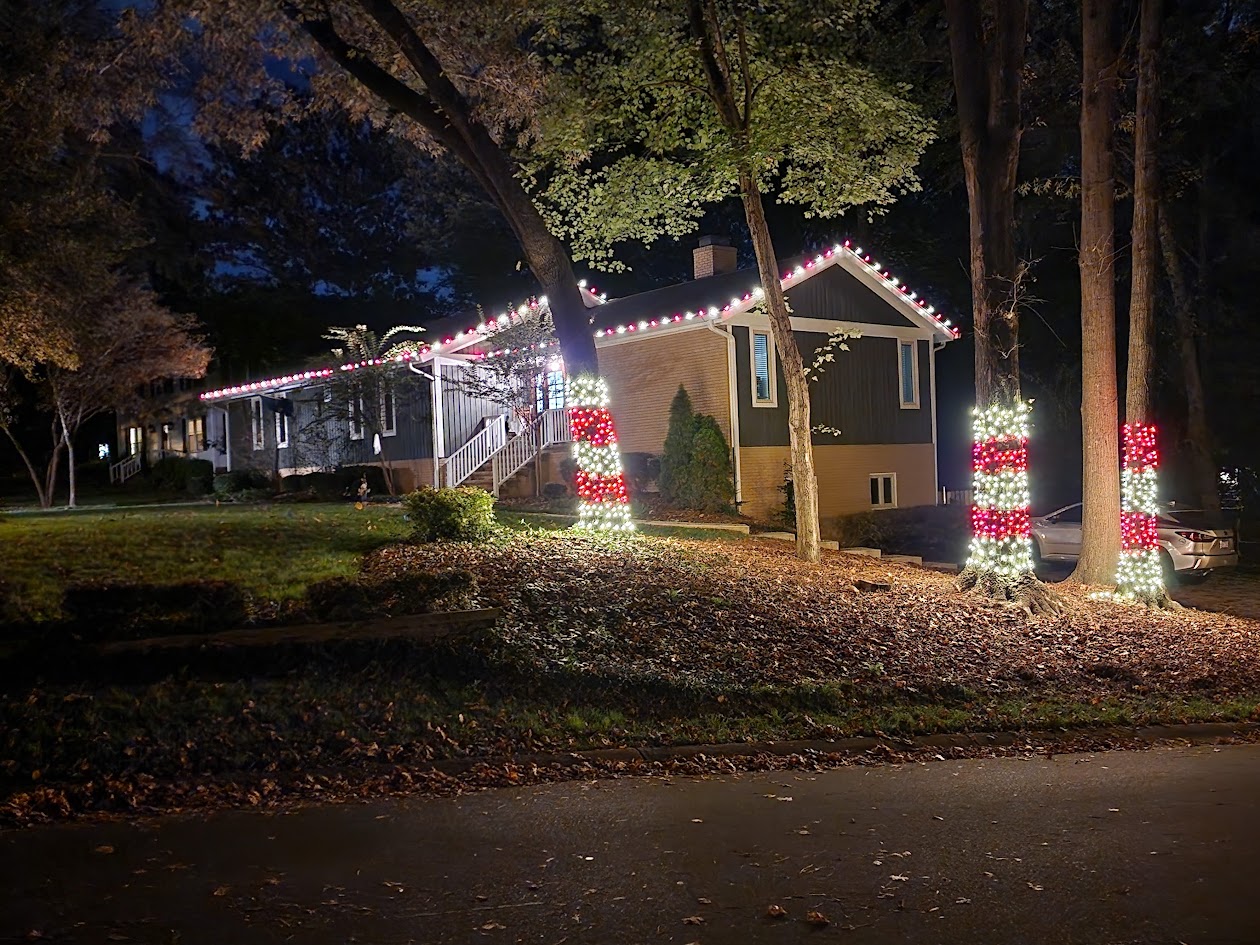Candy-cane roofline and tree-wrap Christmas light installation